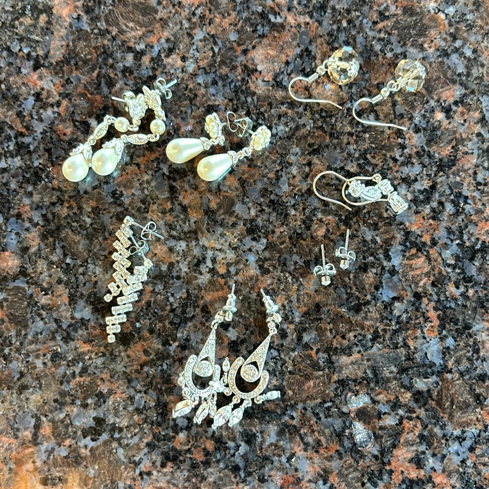 7 pairs white metal earrings